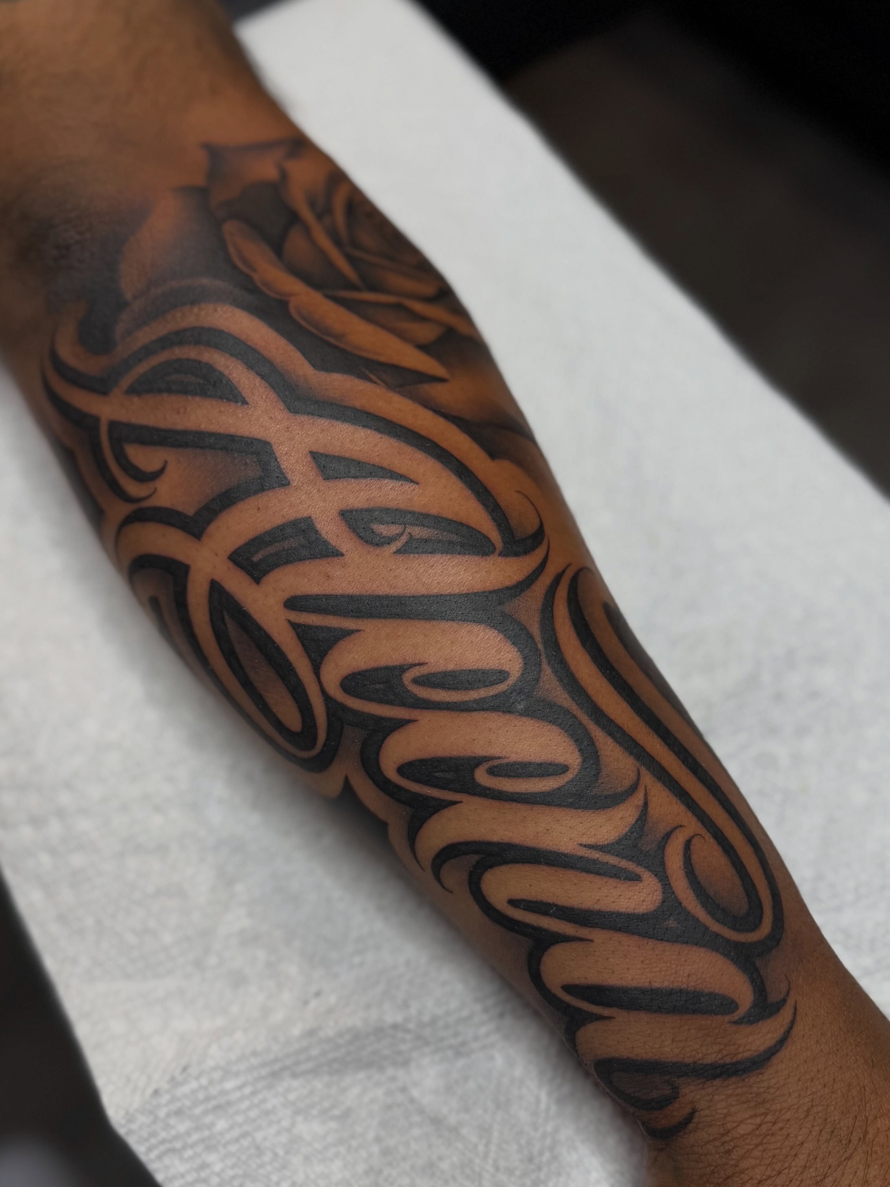 Script lettering lettering script tattoo on the forearm by Rocky G Inkz LLC