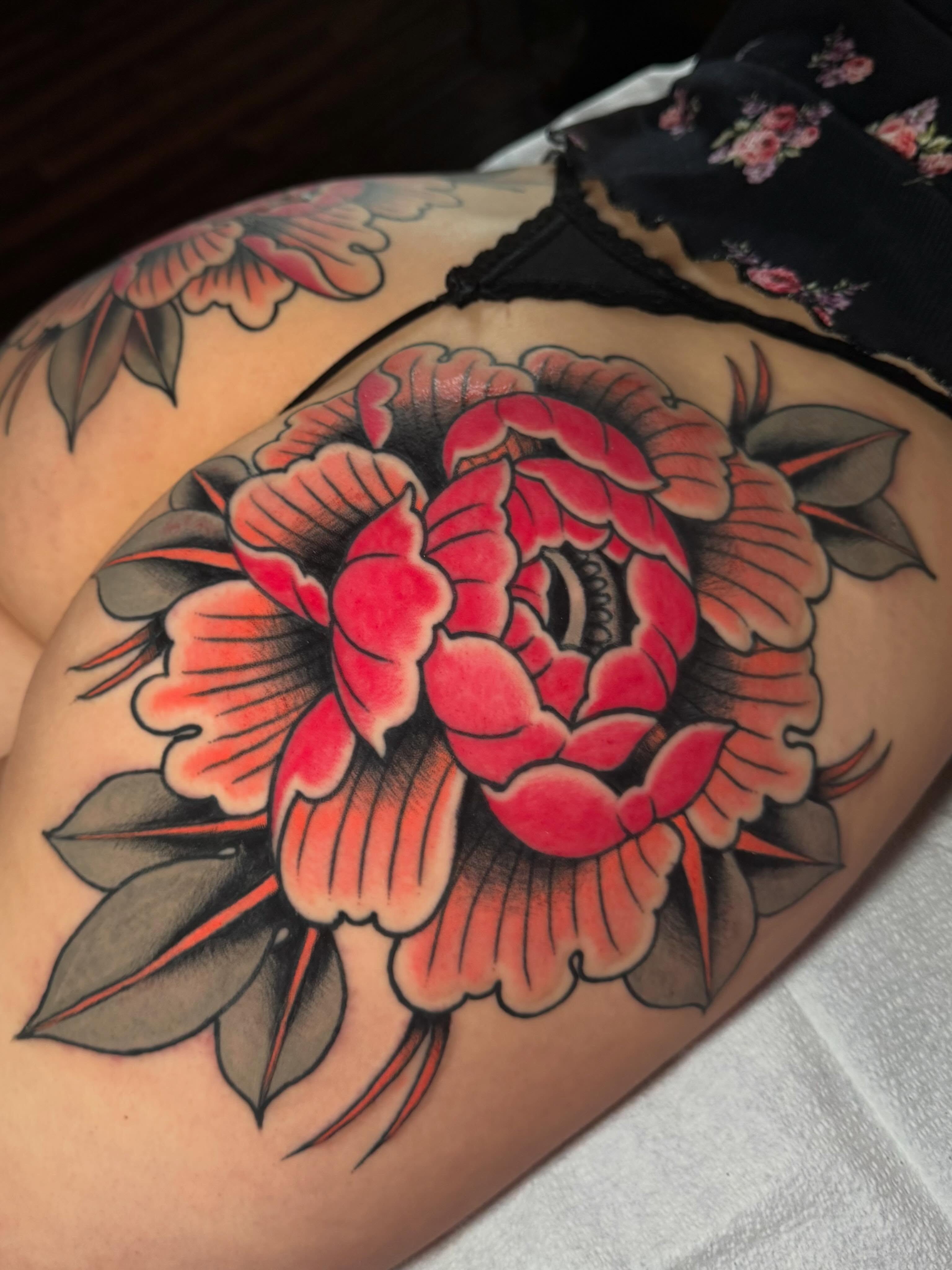 Peony American traditional tattoo on the thigh by Painted Peach Tattooer