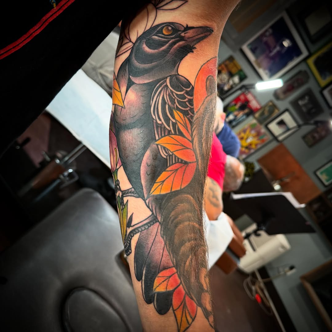 Bird and leaves American traditional tattoo on the forearm by Cory Haberman