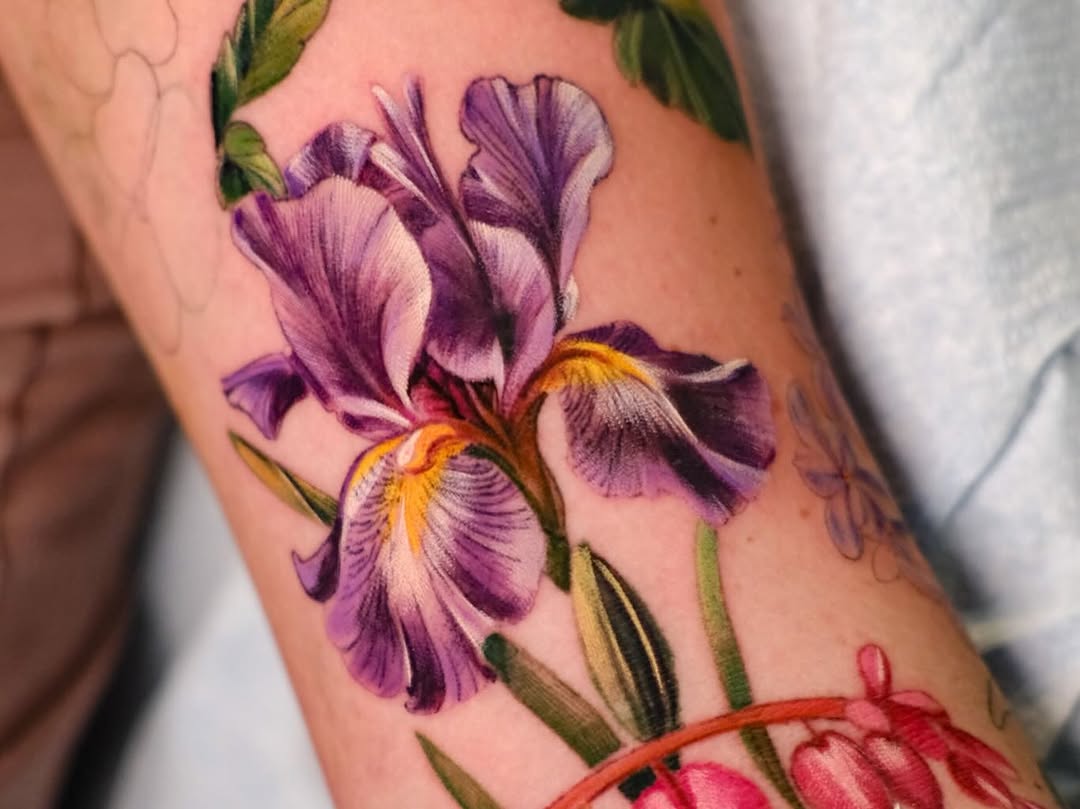 Purple iris flower watercolor tattoo on the forearm by Andres Acevedo, Denver, Colorado