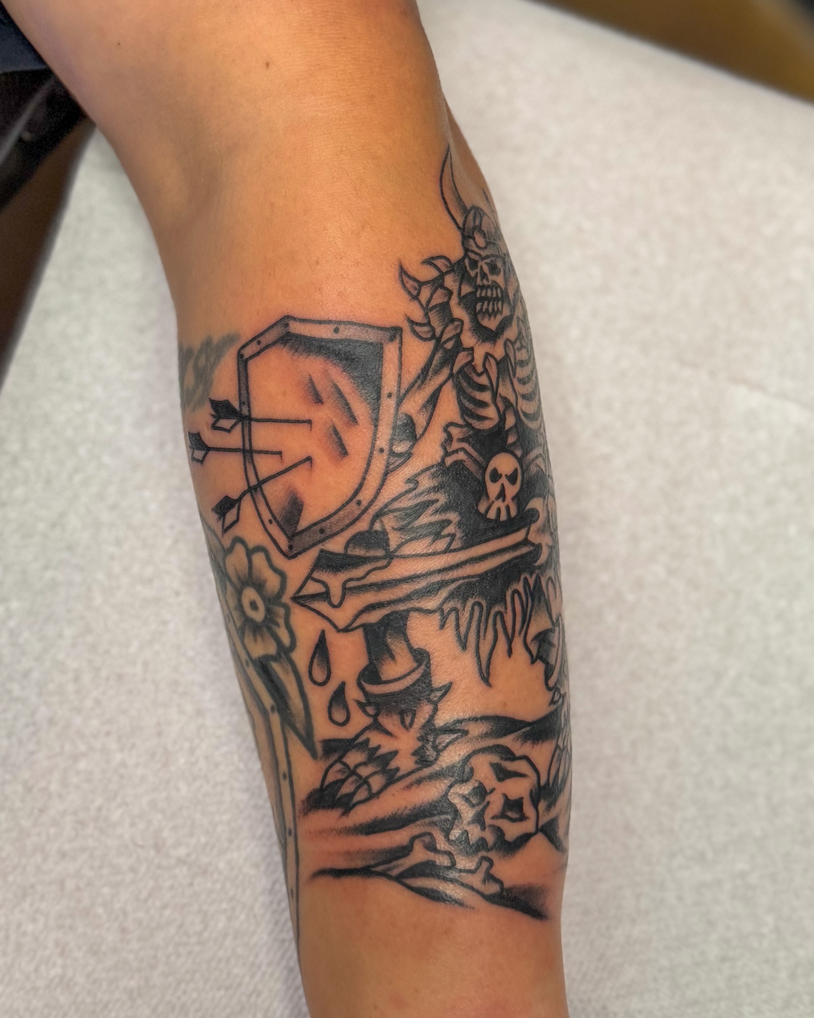 Warrior shield black and grey tattoo on the forearm by Zac Tattooer