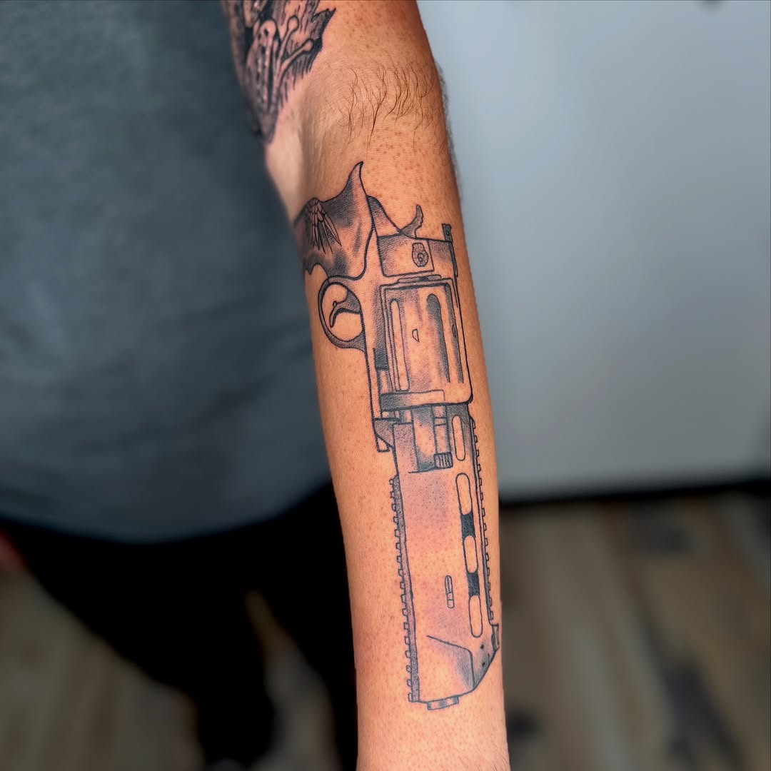 Revolver gun anime tattoo on the forearm by K Valentine