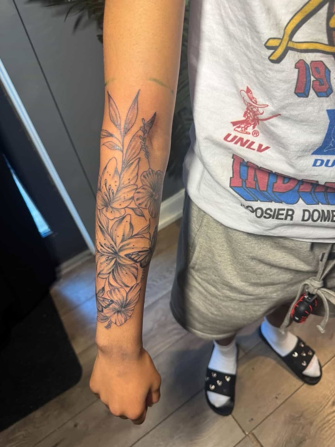 Floral arrangement with butterflies fine line tattoo on the forearm by SpicyMvstardInkk