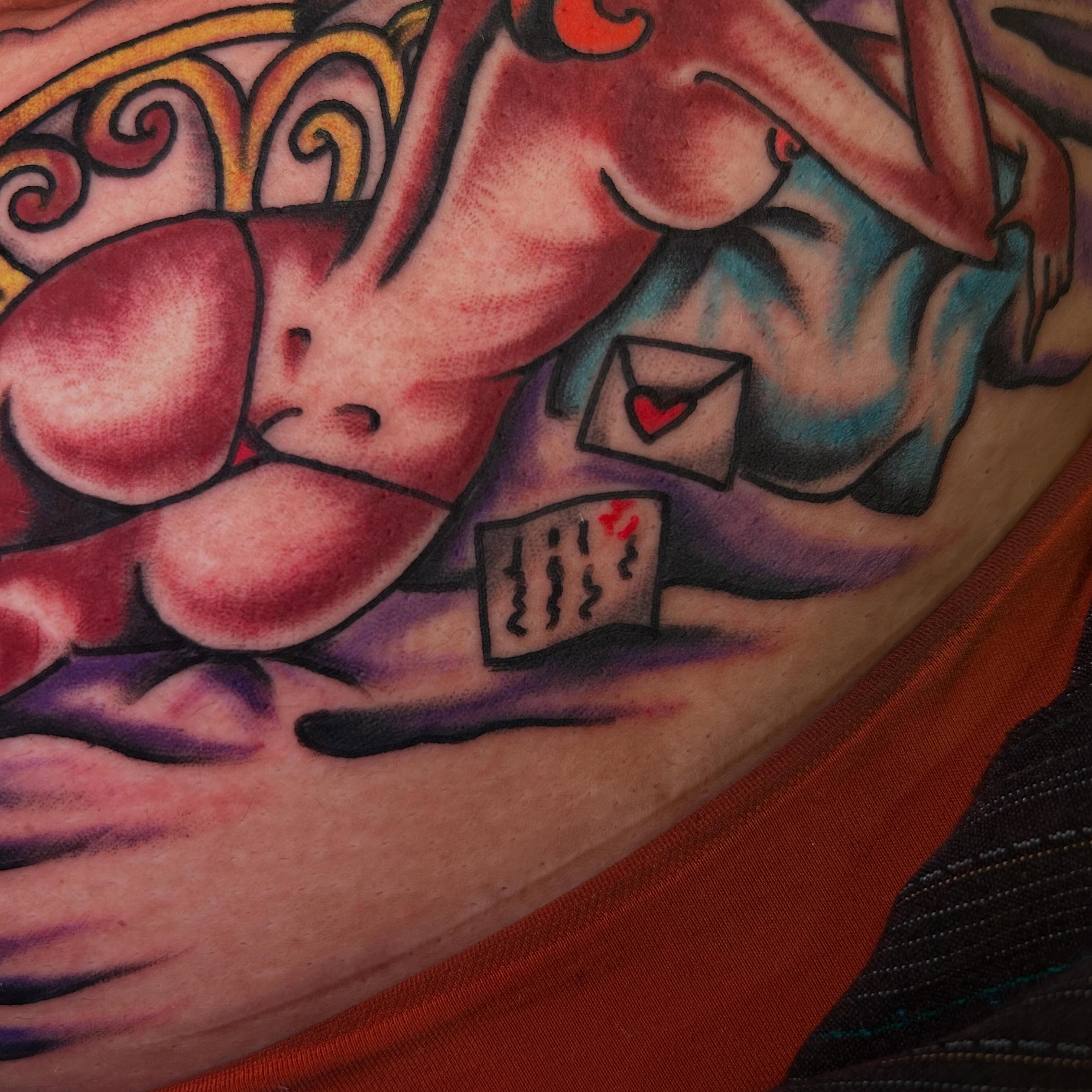 Naked woman with envelope American traditional tattoo on the thigh by Sanjuanita