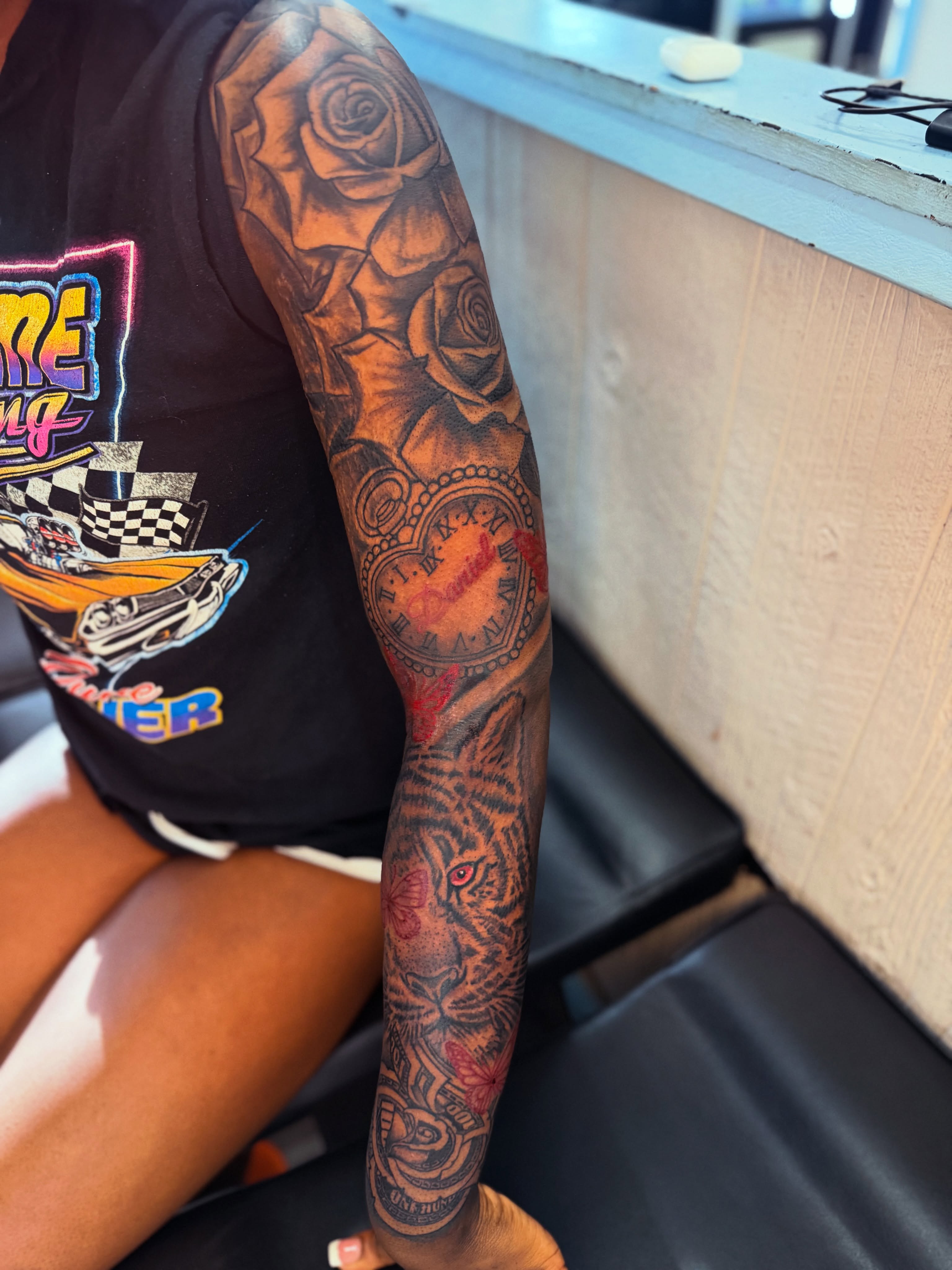 Roses and tiger American traditional tattoo on the forearm by JAE, Shreveport, Louisiana