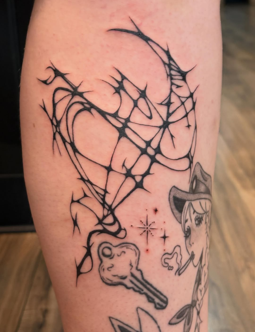 Abstract web heart with key cyber sigilism tattoo on the forearm by izzy solae