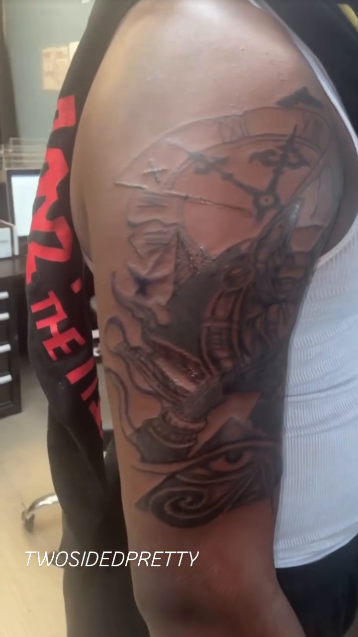 Ship and eye tattoo surrealism tattoo on the upper arm by @twosidedpretty