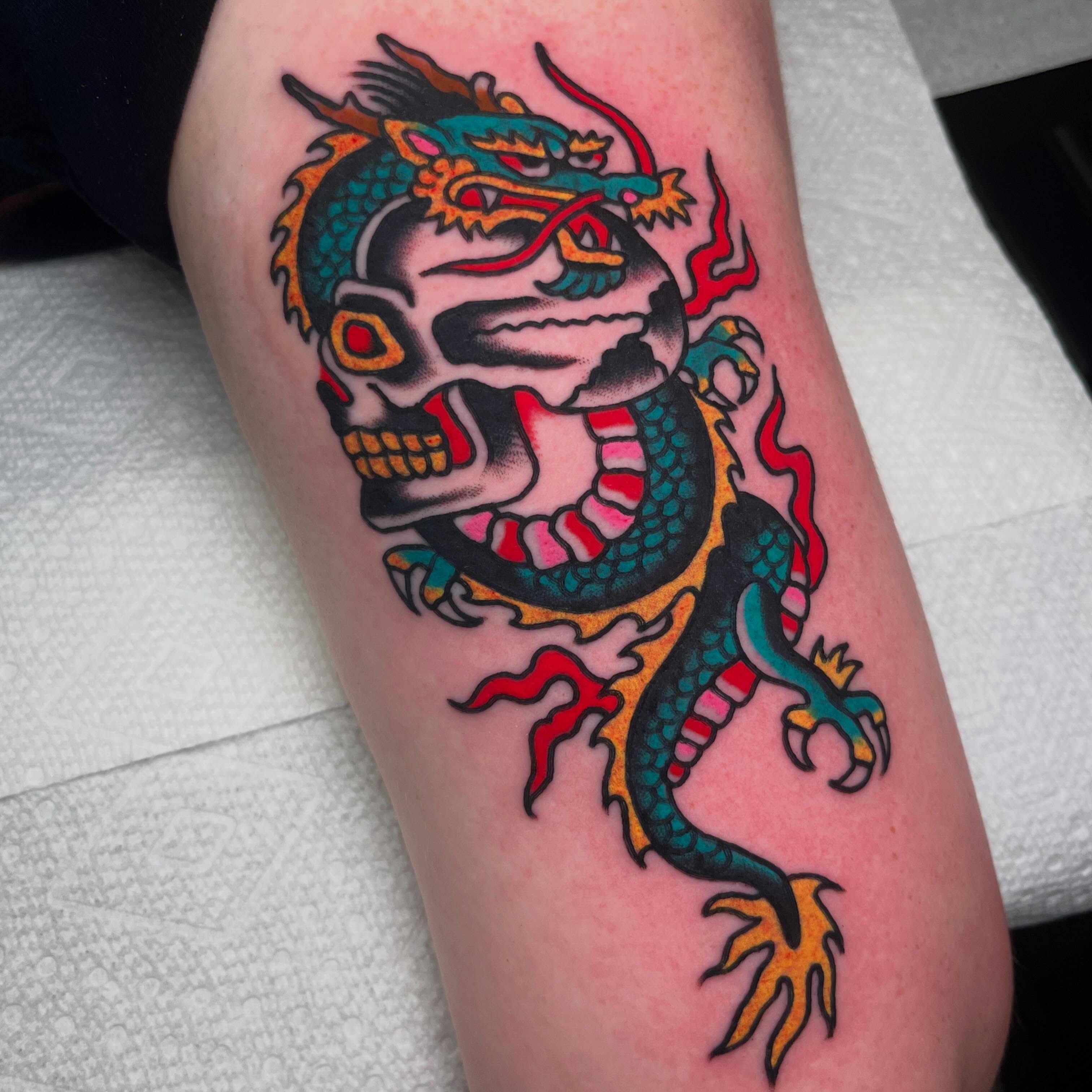 Dragon American traditional tattoo on the forearm by Rizzo