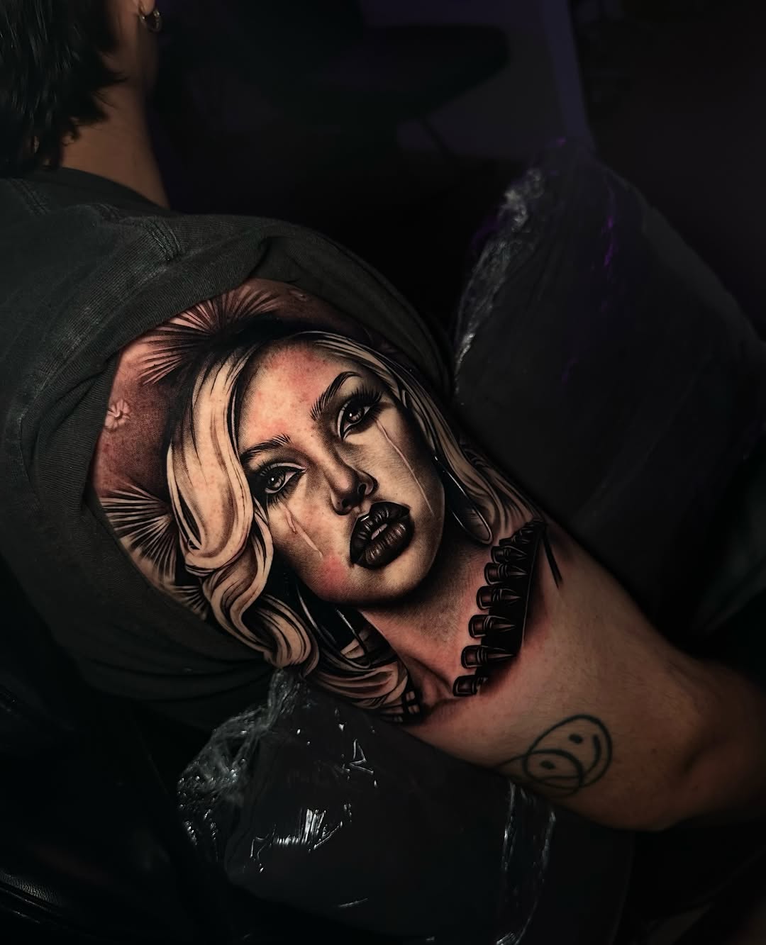 Portrait of a woman with bullets realism tattoo on the shoulder by Emma Sferdian🇷🇴