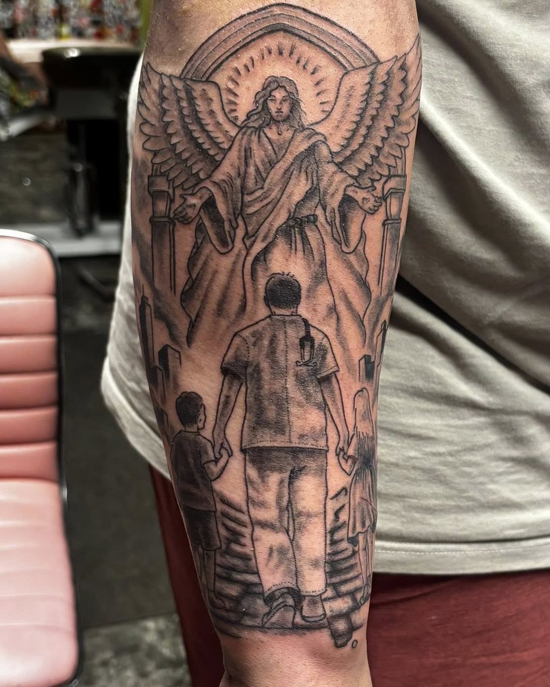 Religious scene realism tattoo on the forearm by Jeff Zuptich