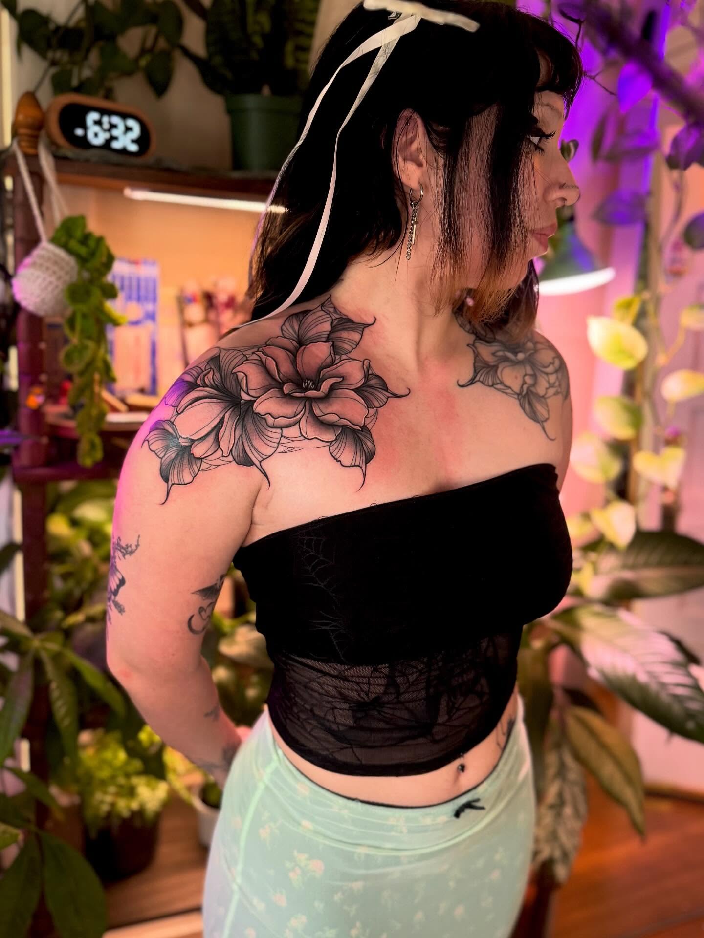 Floral black and grey tattoo on the shoulder by Angie Cotton