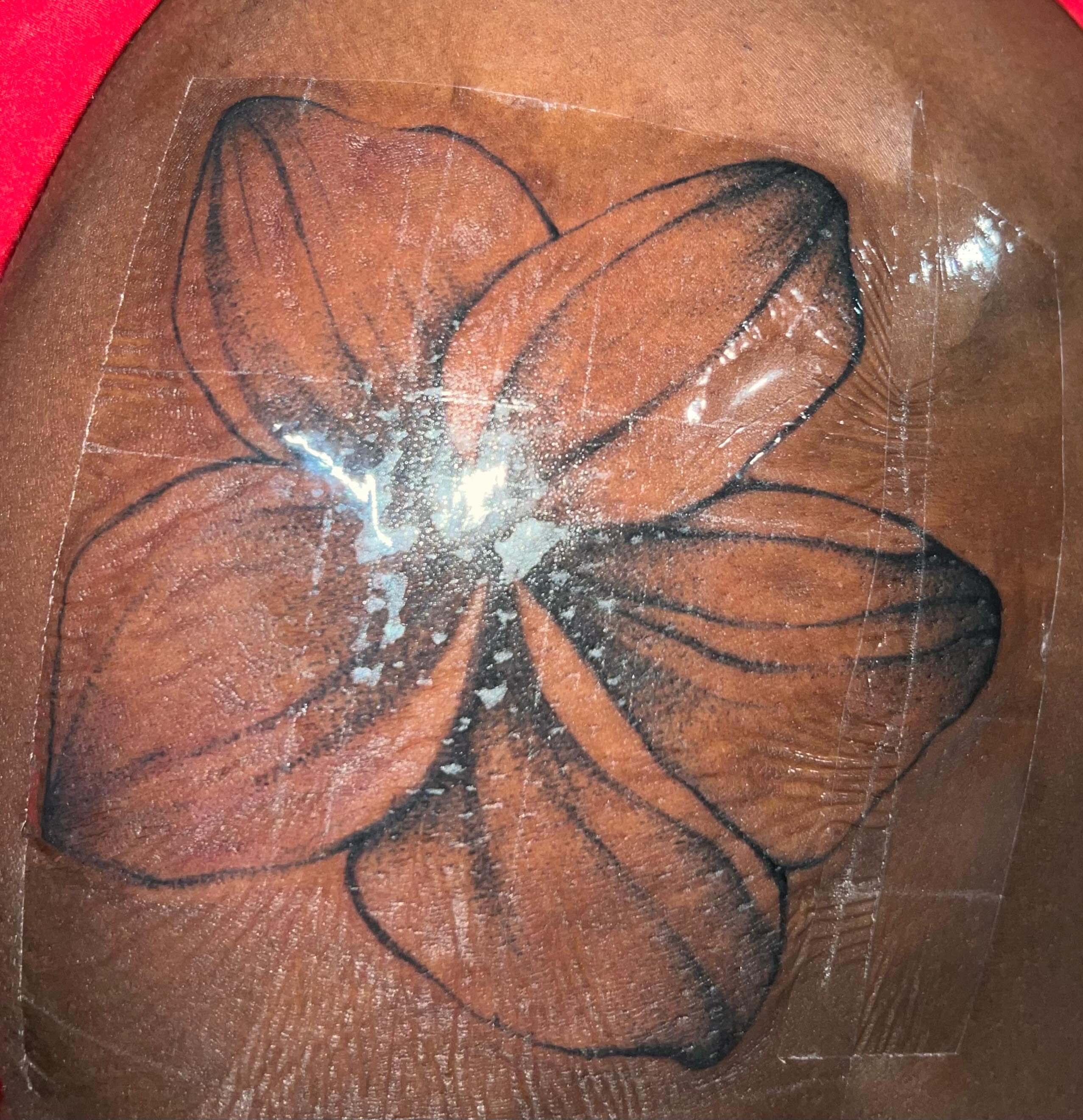 Flower dotwork tattoo on the thigh by Haiiitattoo