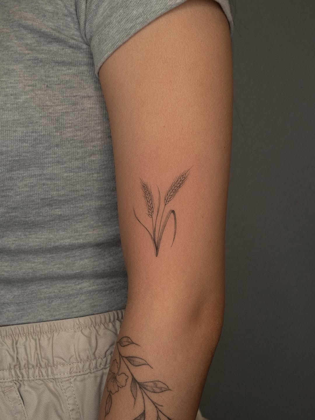 Wheat stalks minimalist tattoo on the forearm by ๐๐๐ฆ ๐๐ ๐ฎ๐ฒ๐๐ง