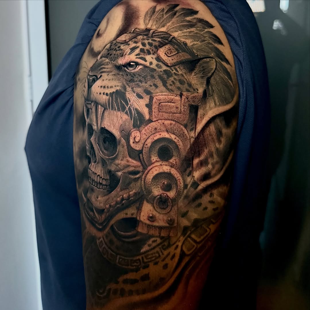Jaguar and skull realism tattoo on the shoulder by Meza Cruz