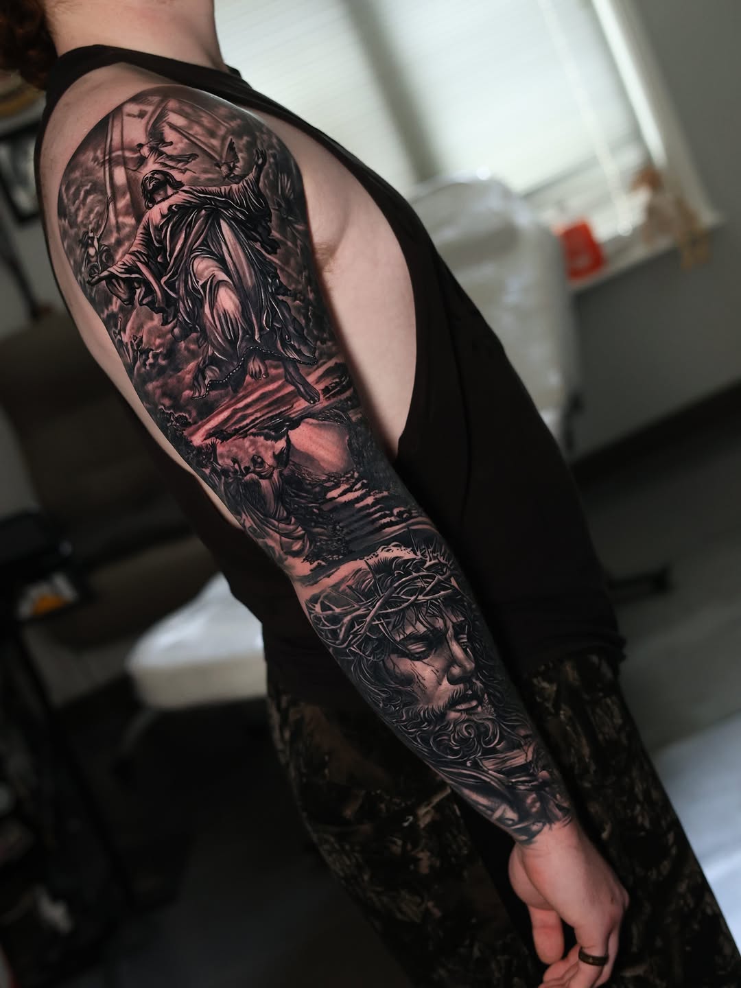 Jesus Christ with crown of thorns realism tattoo on the forearm by Insight Ink Tattoo