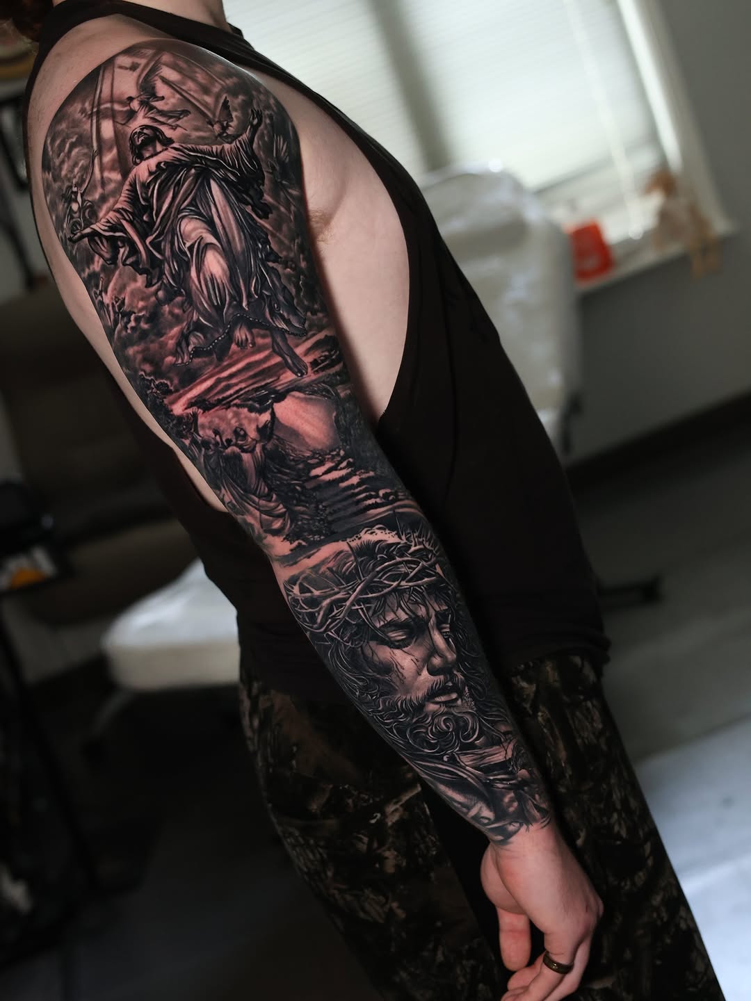 Jesus Christ sleeve realism tattoo on the upper arm by Insight Ink Tattoo