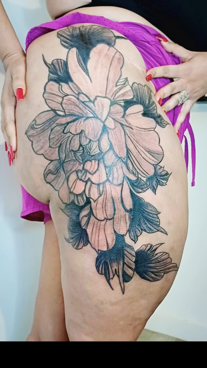 Large floral thigh tattoo dotwork tattoo on the back by Miami Beach Tattoo Artist