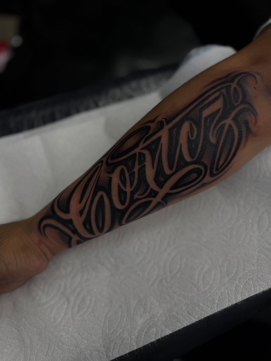 Tattoo by @alex_tatts760 — lettering_script, chicano