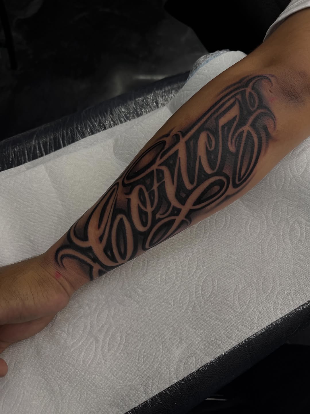 Tattoo by @alex_tatts760 — lettering_script, chicano
