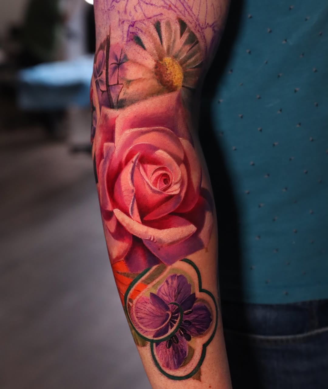 Rose and purple flower neo-traditional tattoo on the forearm by Naomi Burke, New Westminster, British Columbia