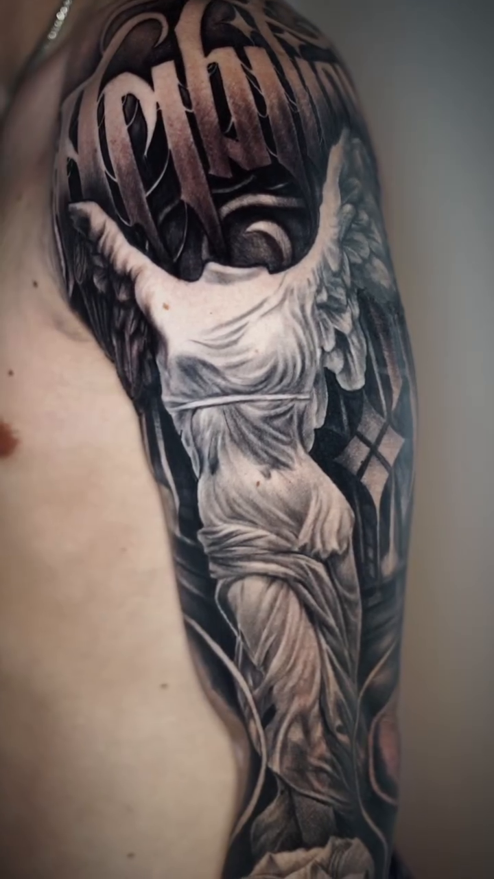 Tattoo by @angelo_tattooink — realism, black_and_grey