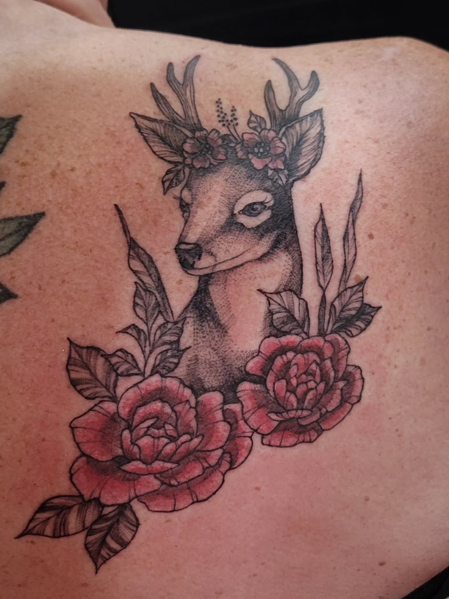 Deer with floral crown realism tattoo on the shoulder by Tricky Lake, Newfield, New Jersey