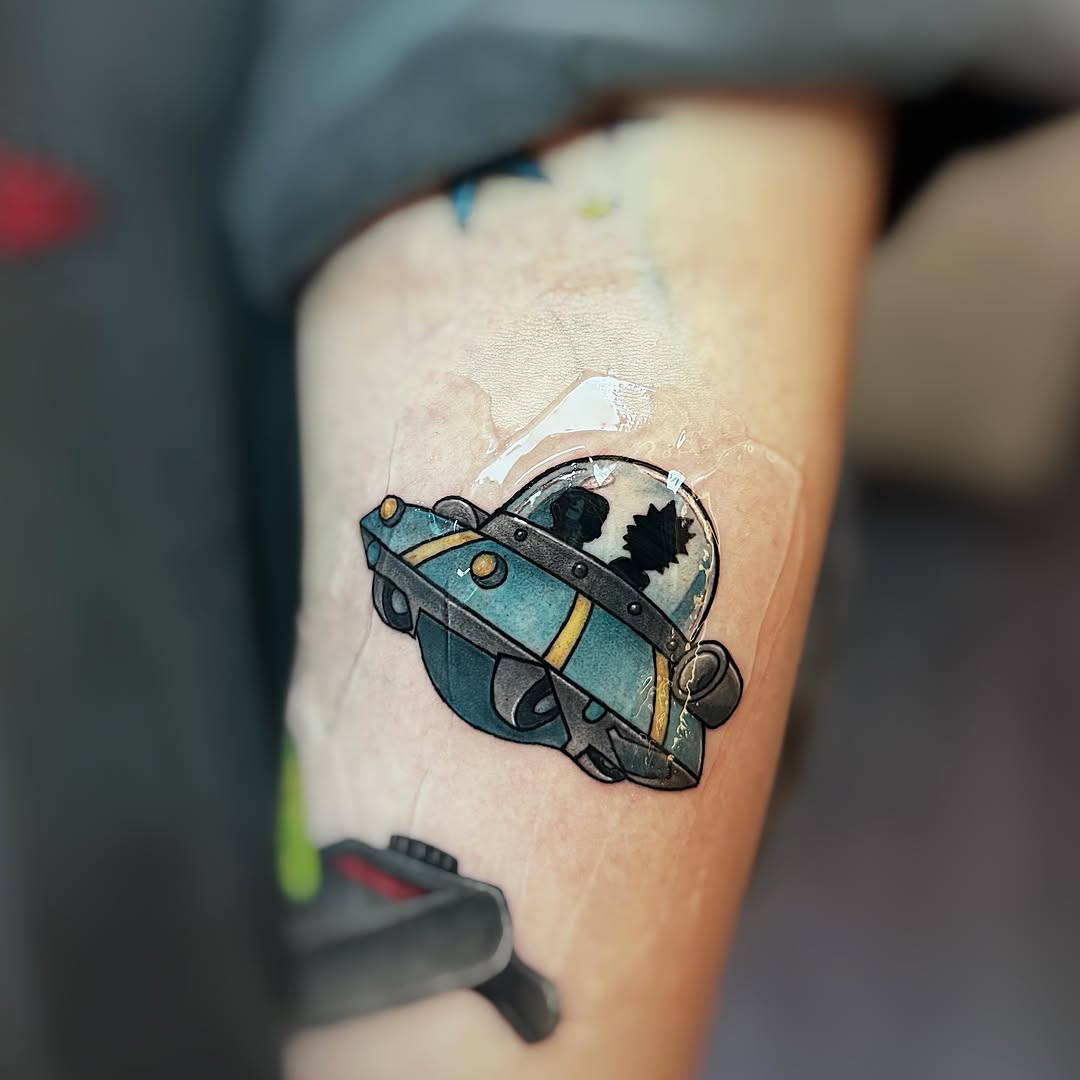 UFO with figures inside new school tattoo on the forearm by 墨匠紋身|新店店, New Taipei City