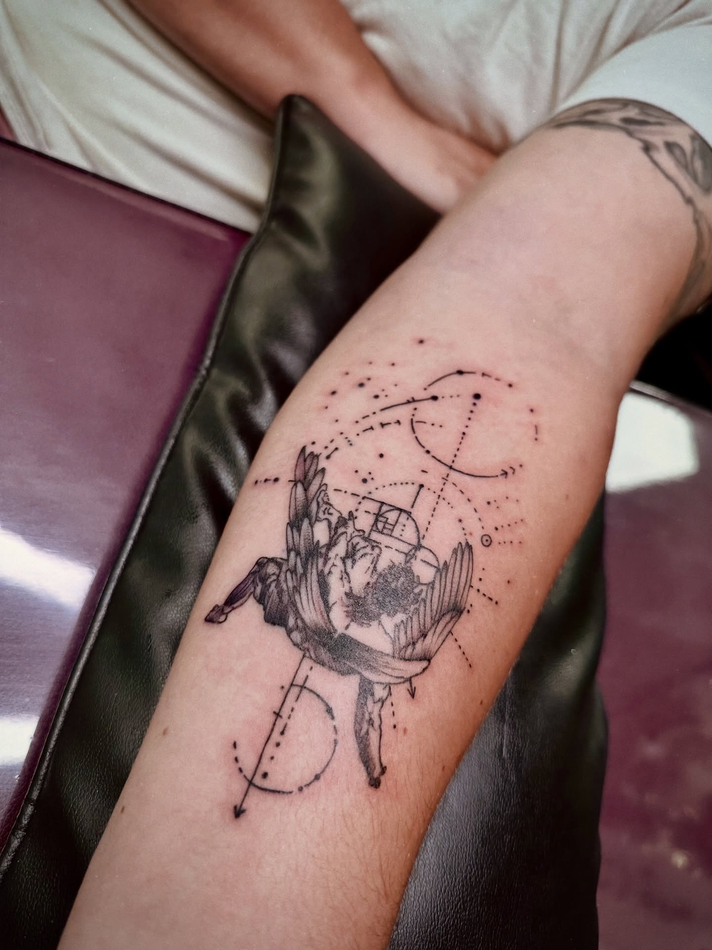 Flower and geometric shapes dotwork tattoo on the forearm by Marlyn “Lala”