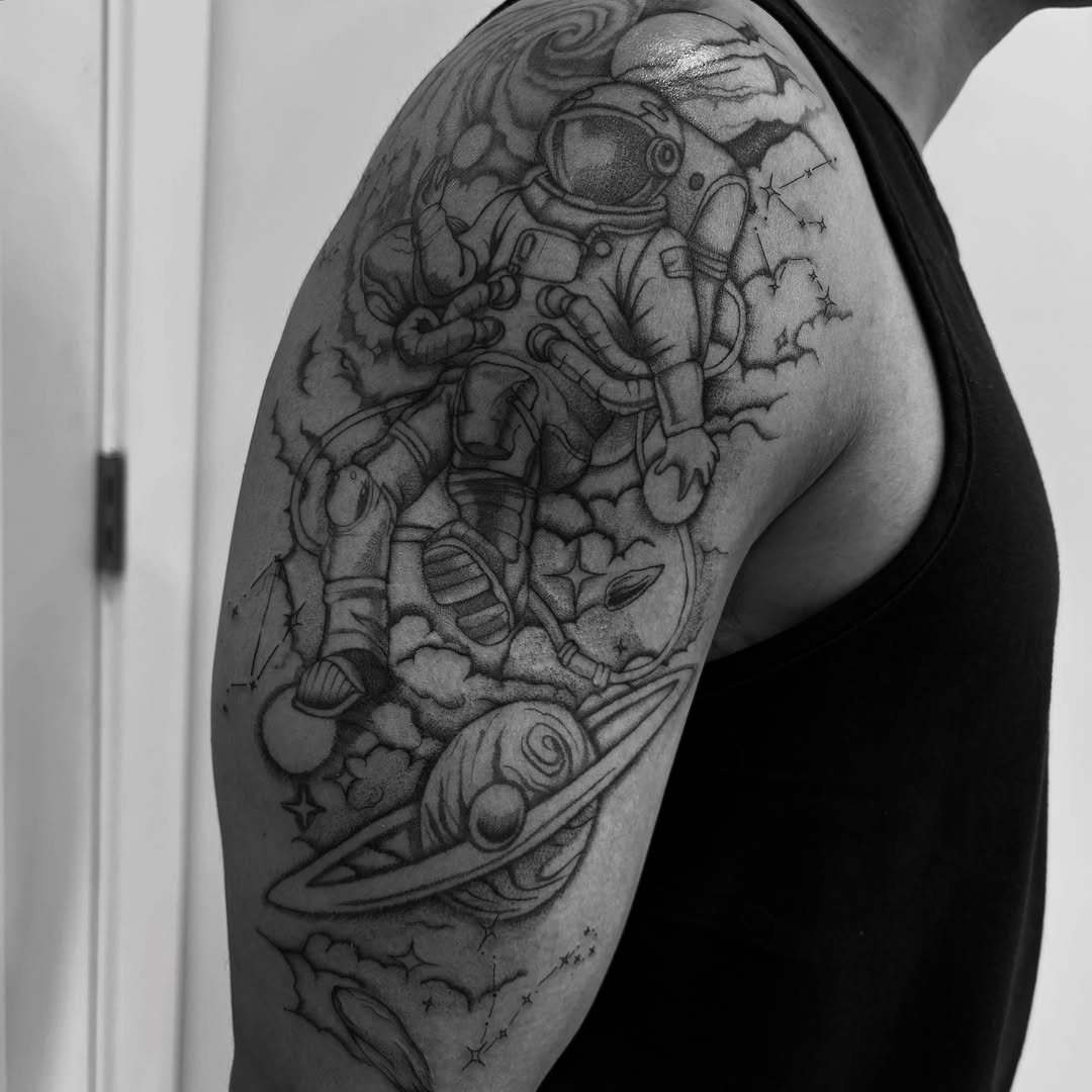 Astronaut and planet realism tattoo on the shoulder by Tayler, Tooele, Utah