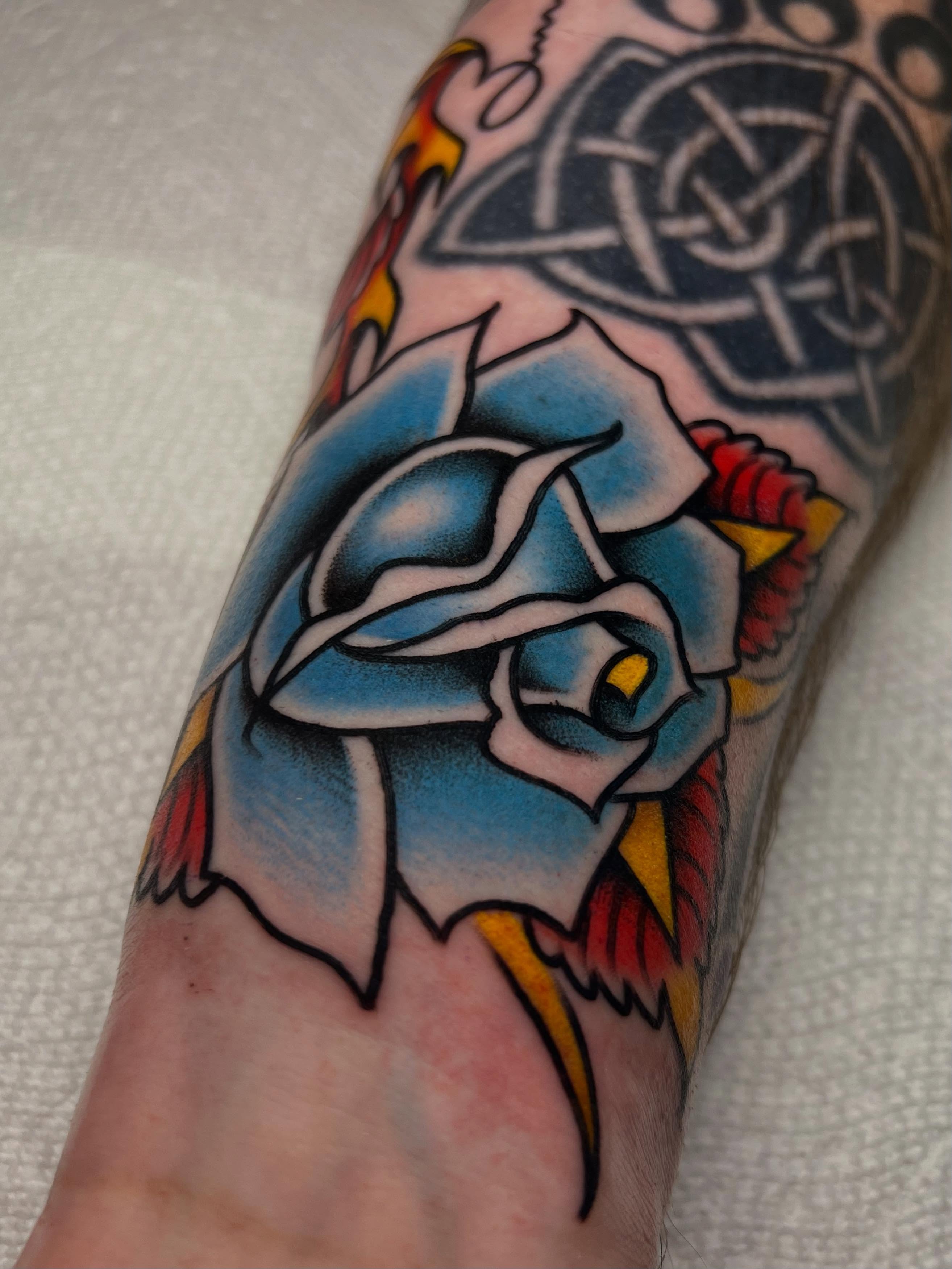 Blue rose American traditional tattoo on the forearm by ᴍᴀᴛᴛ ᴀʟᴇxᴀɴᴅᴇʀ
