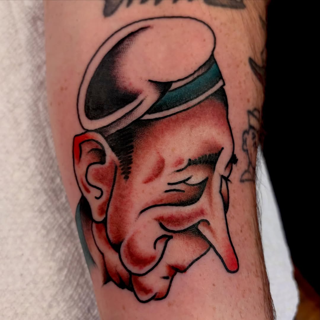 Man with sunglasses American traditional tattoo on the forearm by Shane Coslett