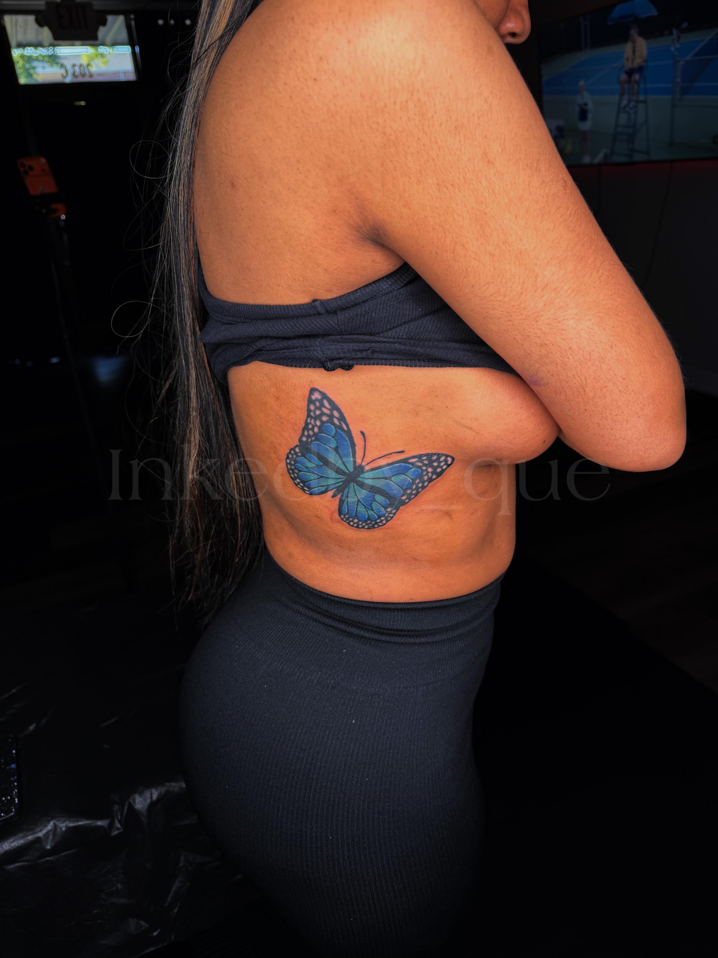 Blue butterfly realism tattoo on the back by Q⚜️