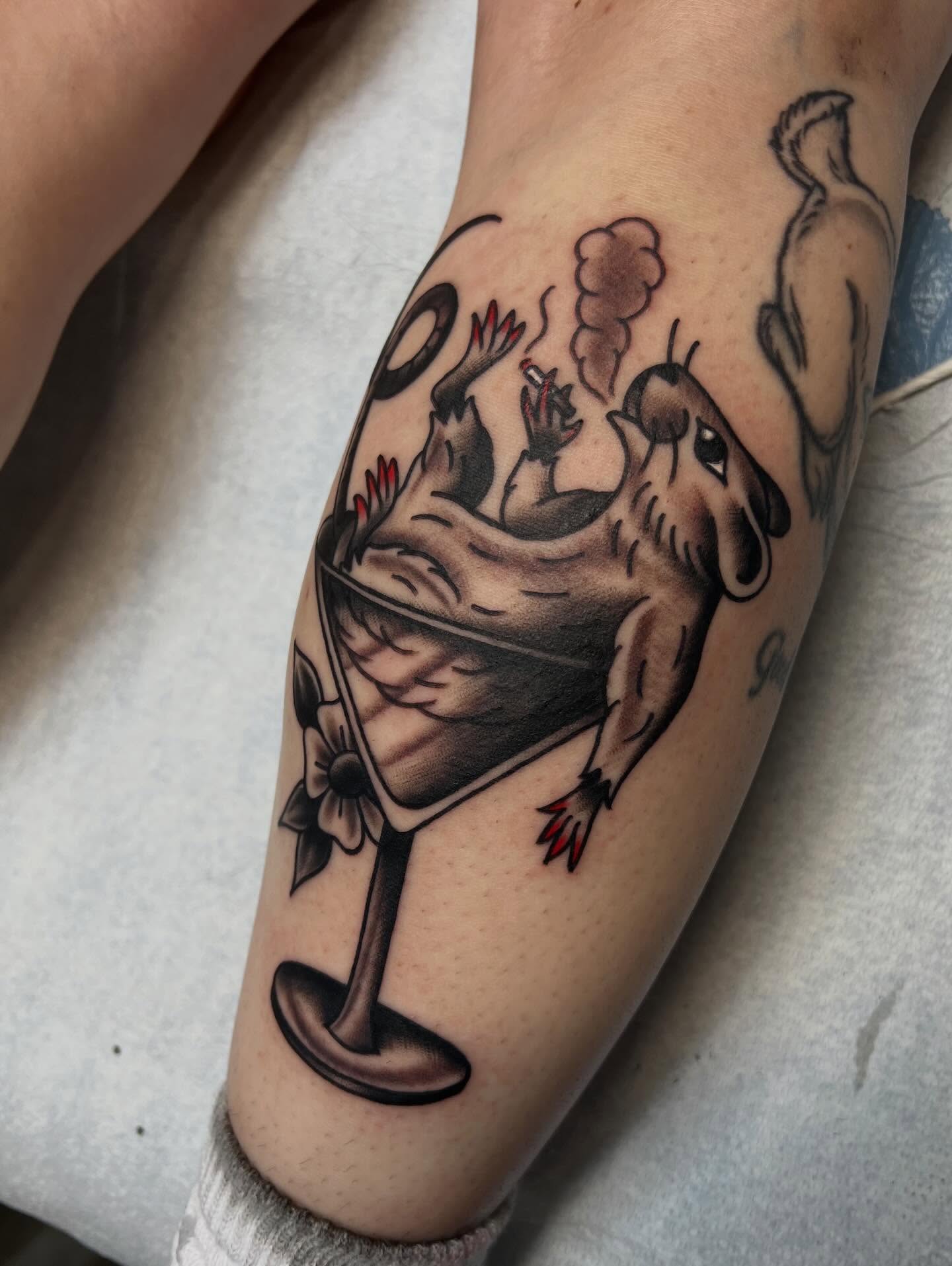 Martini glass with frog American traditional tattoo on the forearm by Tyler Van Pelt