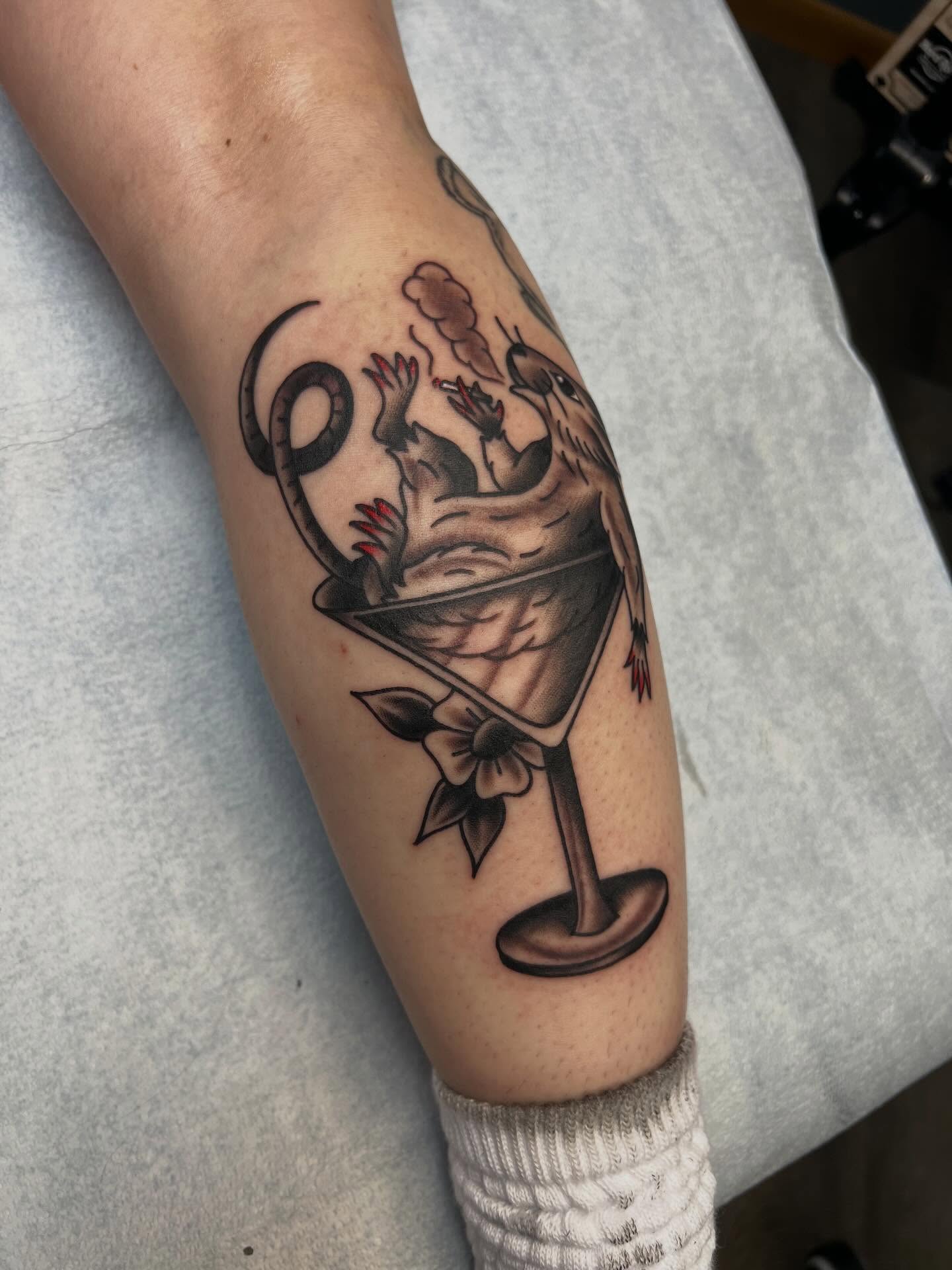 Martini glass with animal American traditional tattoo on the forearm by Tyler Van Pelt