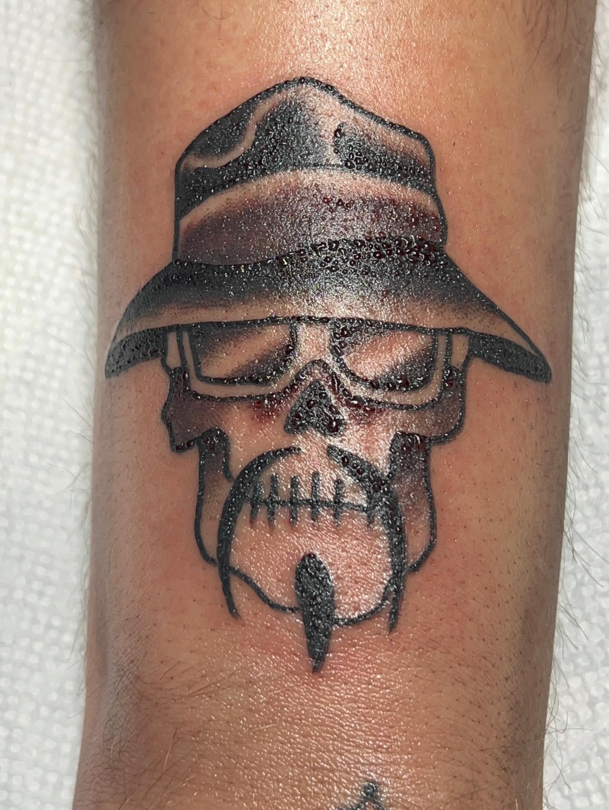 Skull wearing hat dotwork tattoo on the forearm by Casey Lewis - Tattoo Artist, Cleveland Ohio