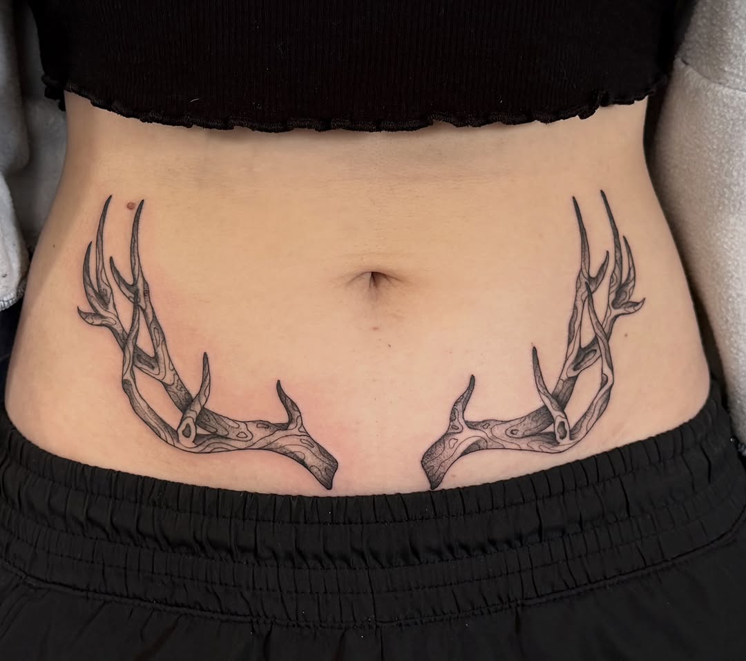 Antlers cyber sigilism tattoo on the torso by Sophia, New Carlisle, Ohio