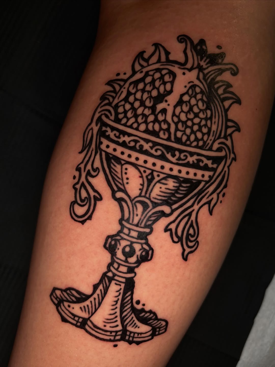 Pomegranate in a chalice dotwork tattoo on the forearm by 𝕵𝖊𝖗𝖊𝖒𝖞 𝕻𝖚𝖗𝖈𝖊𝖑𝖑