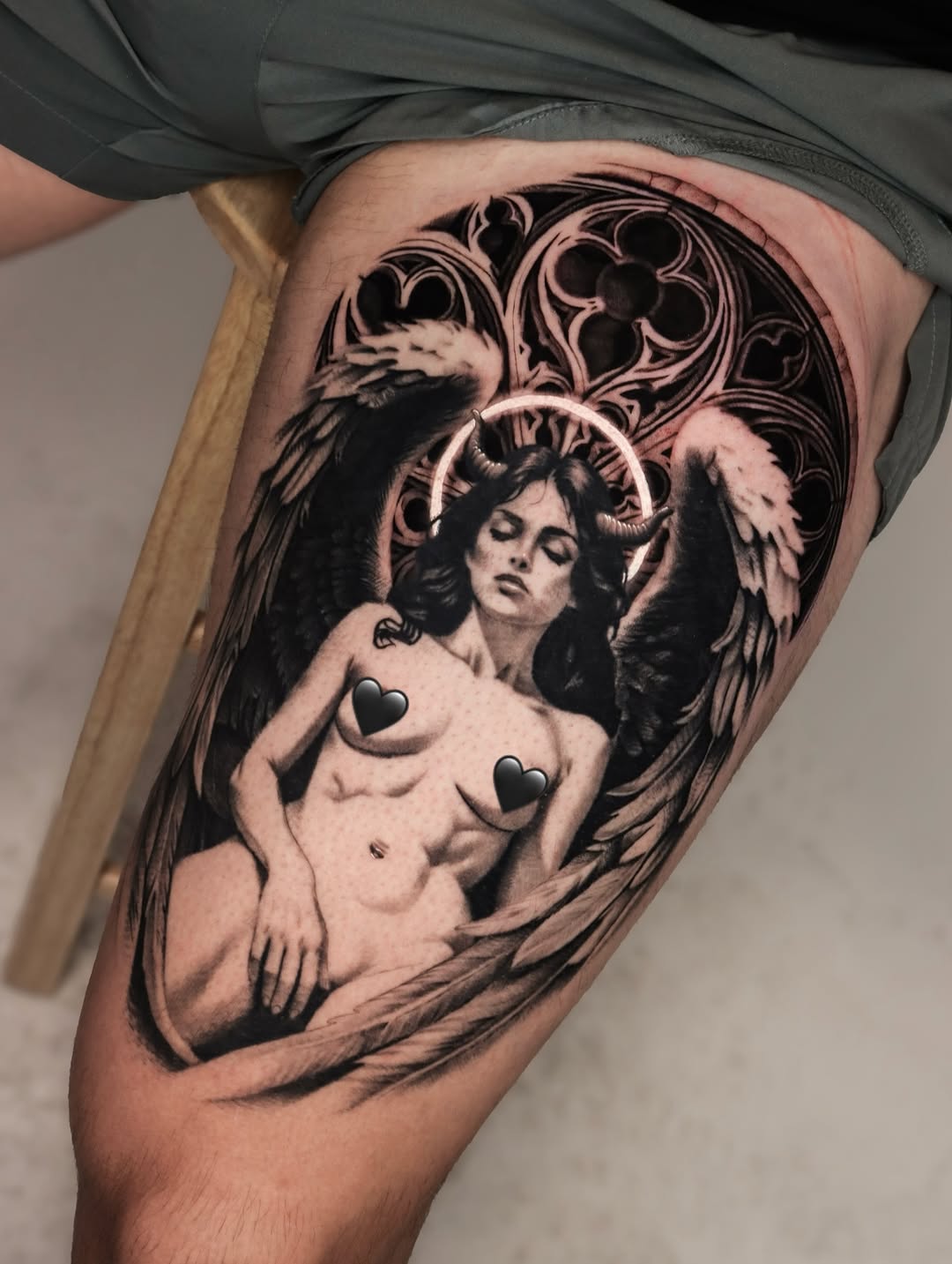 Fallen angel realism tattoo on the thigh by Jeff Reindel