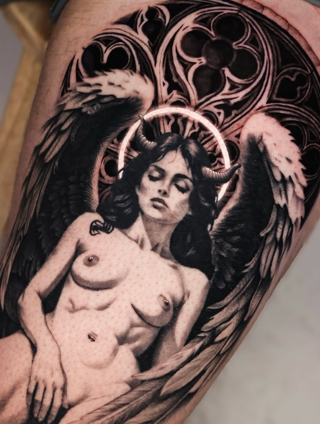 Fallen angel with gothic background realism tattoo on the forearm by Jeff Reindel