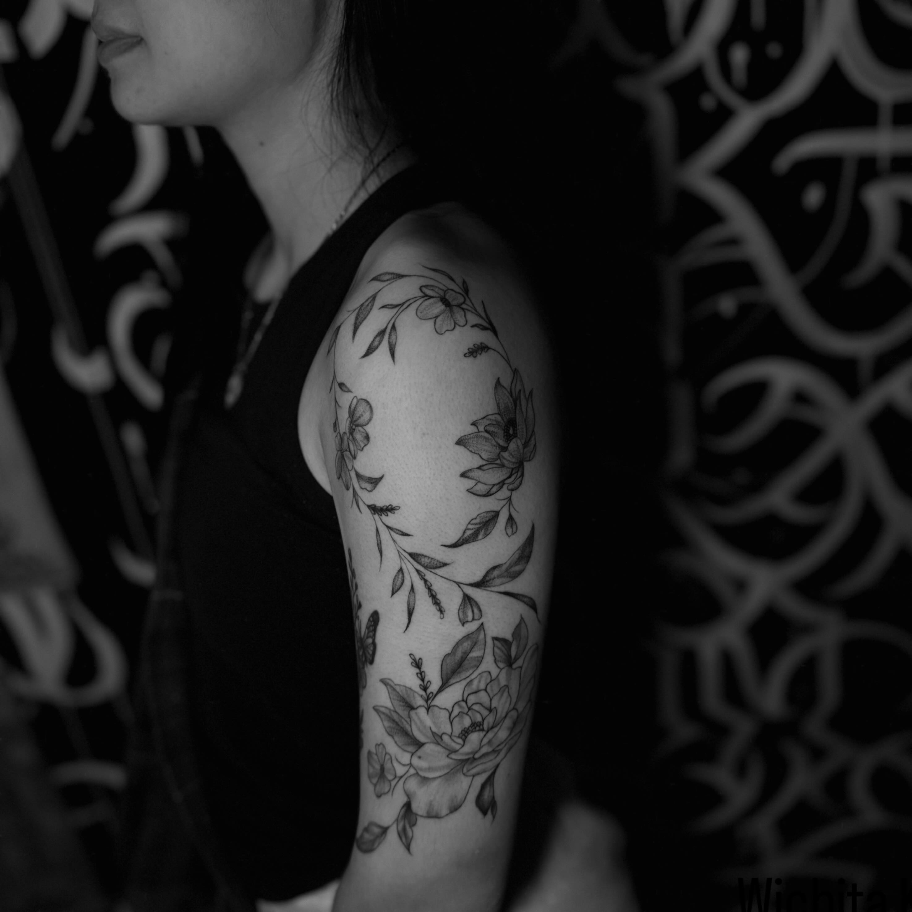 Floral wreath black and grey tattoo on the upper arm by Giana Martinez, Wichita, Kansas