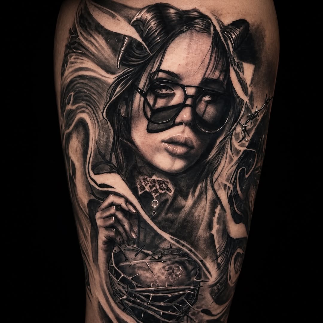 Woman with horns and heart realism tattoo on the forearm by C.J. Rued