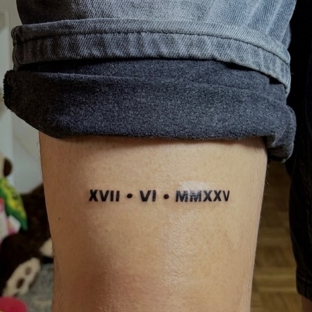 Roman numerals lettering tattoo on the forearm by I N K S L A y e R