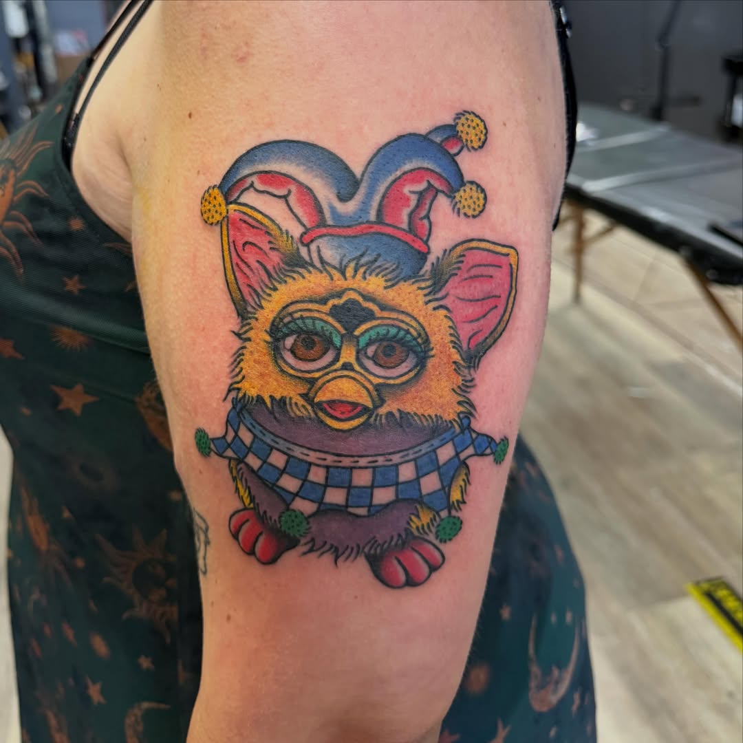 Jester cat American traditional tattoo on the forearm by Kane L, Albuquerque, New Mexico