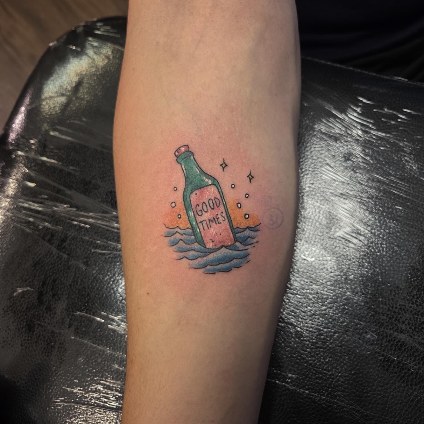 Message in a bottle dotwork tattoo on the forearm by Buk