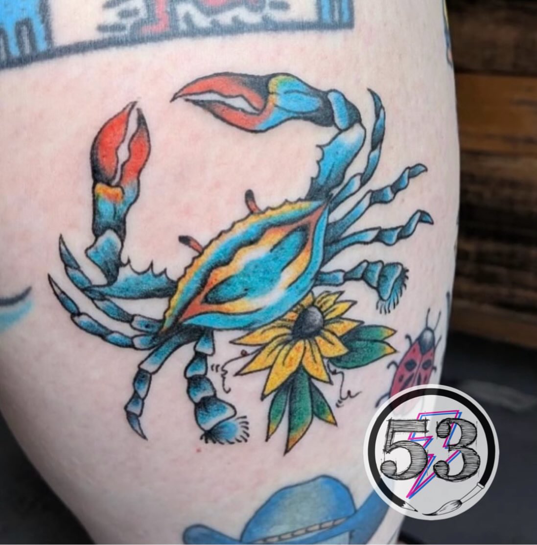 Blue crab American traditional tattoo on the thigh by SHOP53 Tattoo & Art
