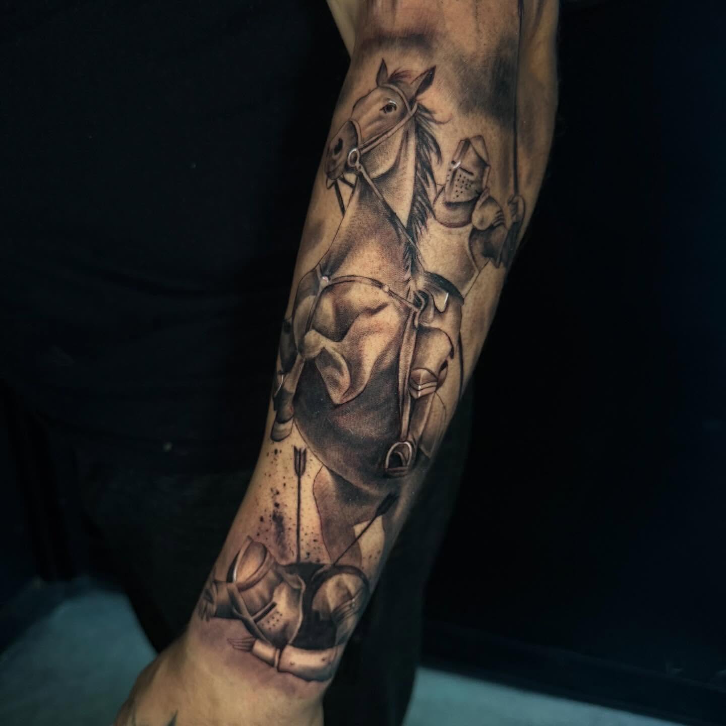 Horse and knight realism tattoo on the forearm by Angela Azure