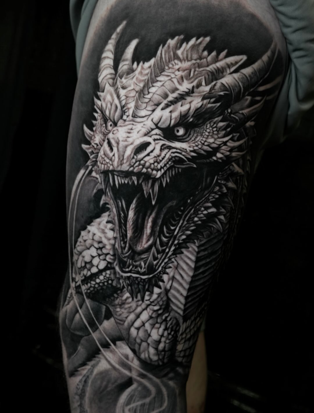 Tattoo by @tattsbyethan_ — realism, black_and_grey