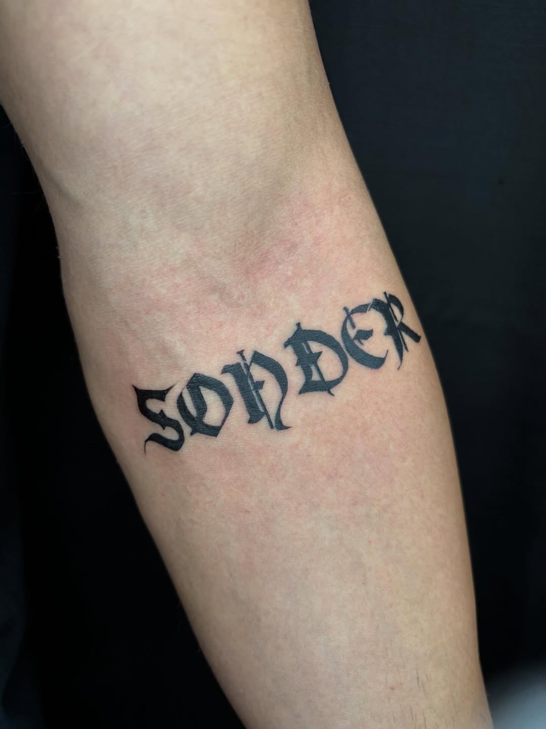Sonder lettering lettering tattoo on the forearm by Pres!