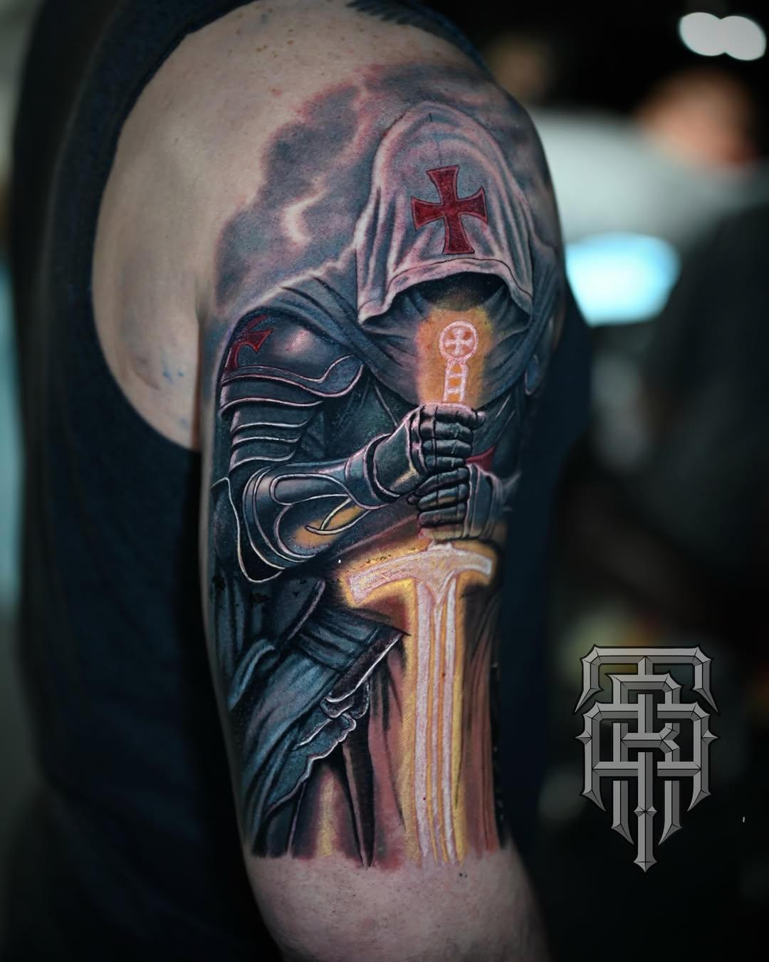 Knight templar dark realism tattoo on the upper arm by Art Lopez