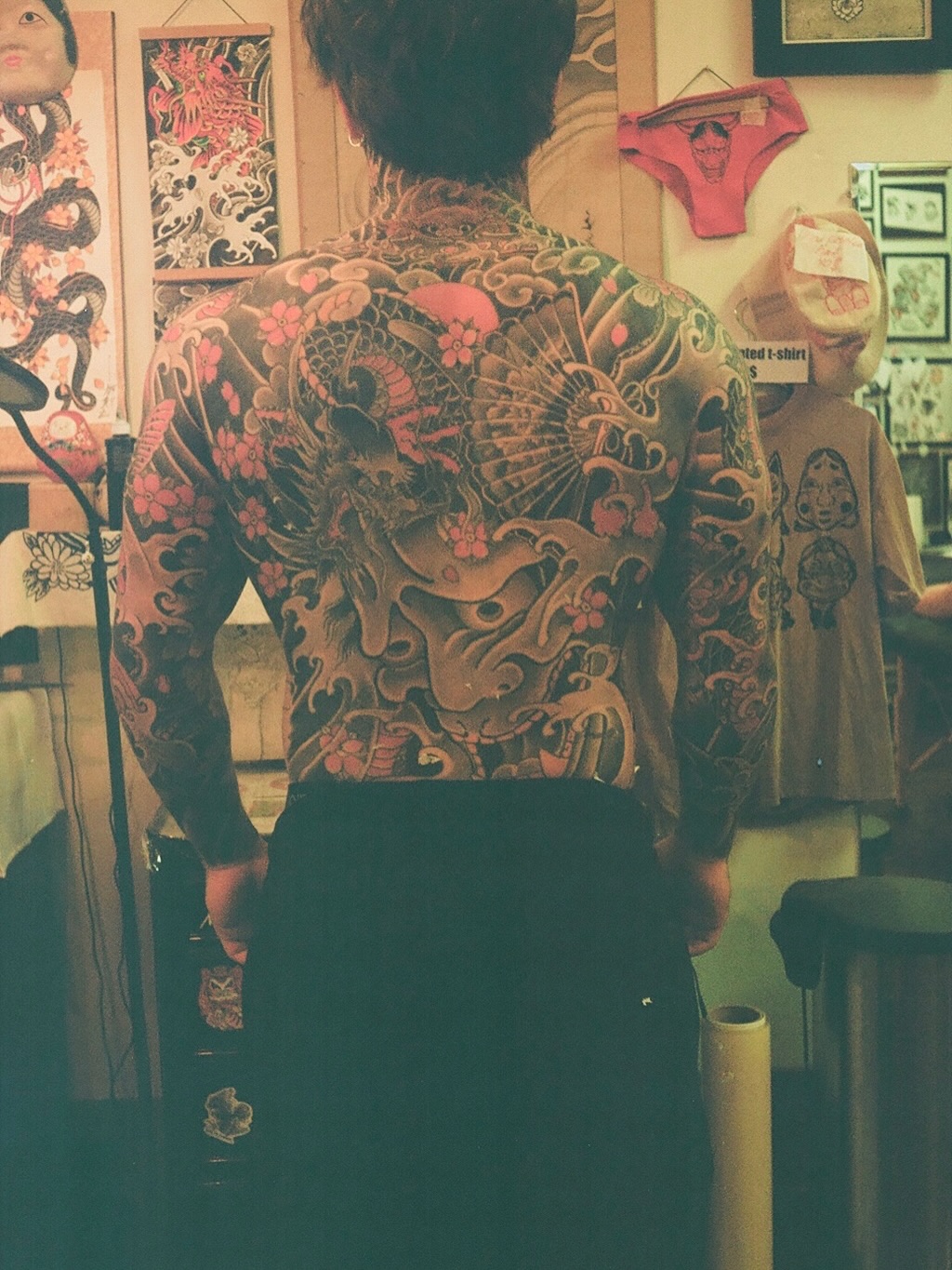 Dragon and flowers Japanese tattoo on the back by Innokenty Meshchakov, Portland, Oregon